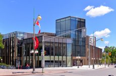 Ottawa, Canada - July 3 2017: Phase 1 of the 110.5 million dollar renovation of the National Arts Centre, featuring the new glass atrium.  The new building was first made available for public tours on July 1, Canada Day.